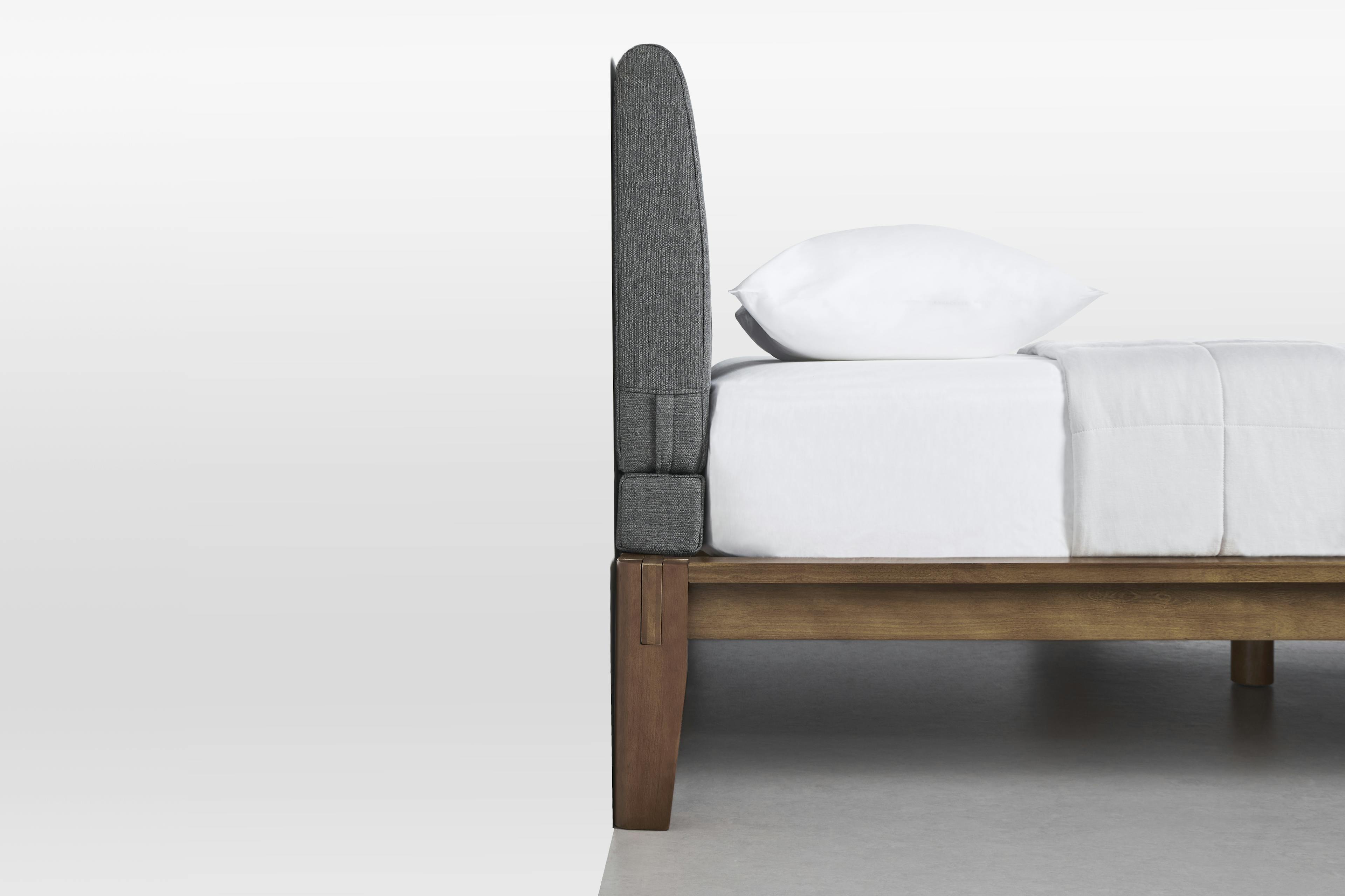 The Bolster in Dark Charcoal Linen Weave on Bed