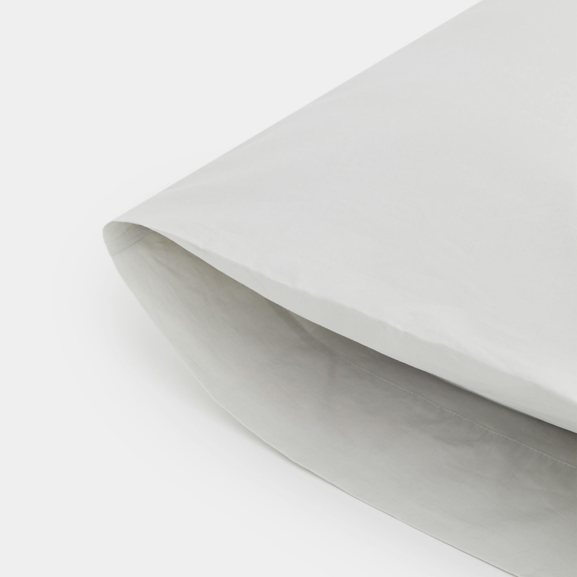 Close-Up View of Thuma Percale Suite Sheet Set in Stone Color