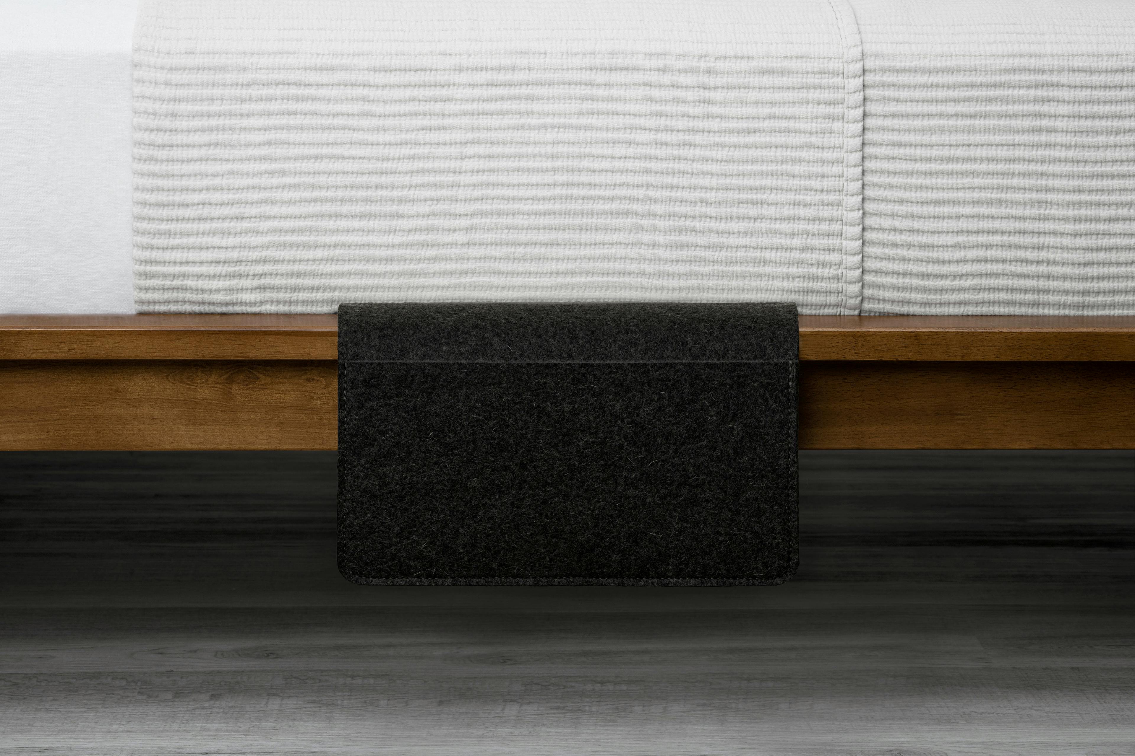 The Sleeve Product in Midnight Black Displayed on Bed