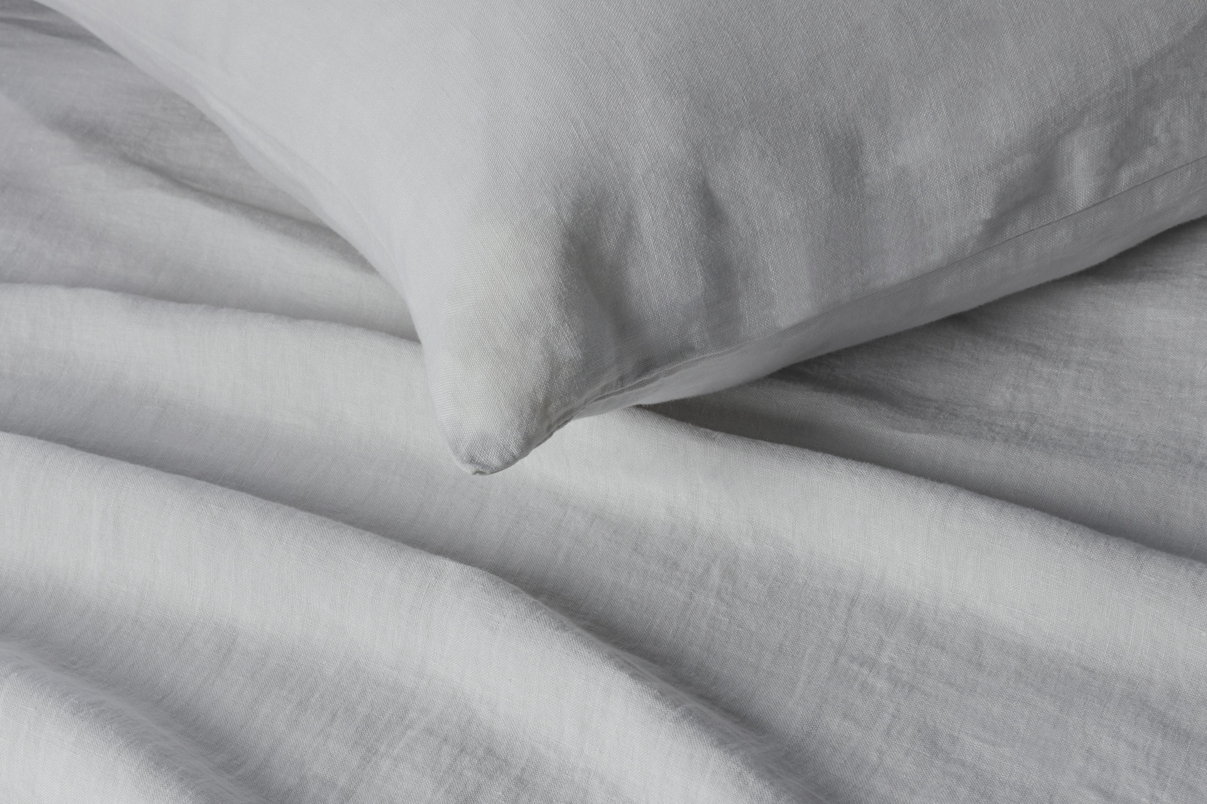 Close-up View of Thuma The Bed with Stone Linen Sheet Set and Pillows